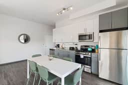 2BR City Loft Sweeping Glass Views - Image 3