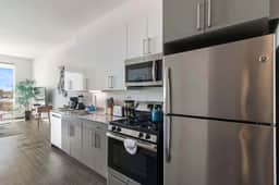 1BR City Loft With Modern Glass Views - Image 2