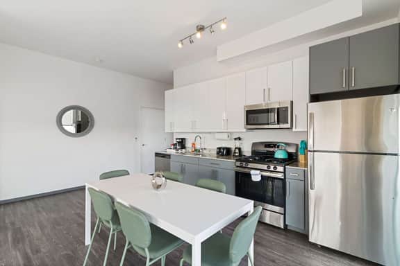2BR City Loft Sweeping Glass Views - Image 3