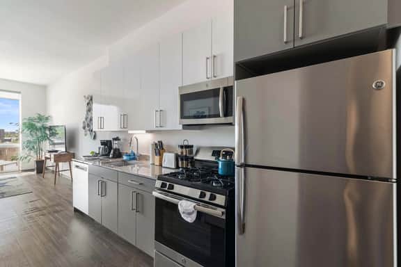 1BR City Loft With Modern Glass Views - Image 2
